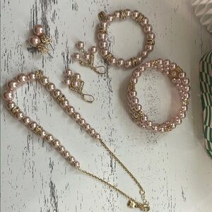Pink pearl jewelry set with gold details